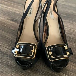 Guess black, sling back peep toe heels.